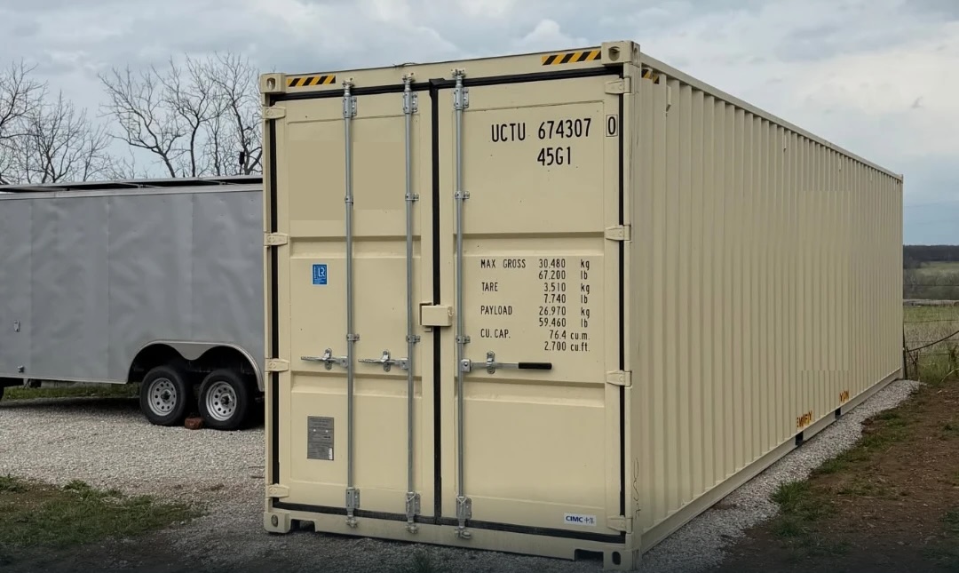 A 40' High Cube container delivered to a customer's gravel lot